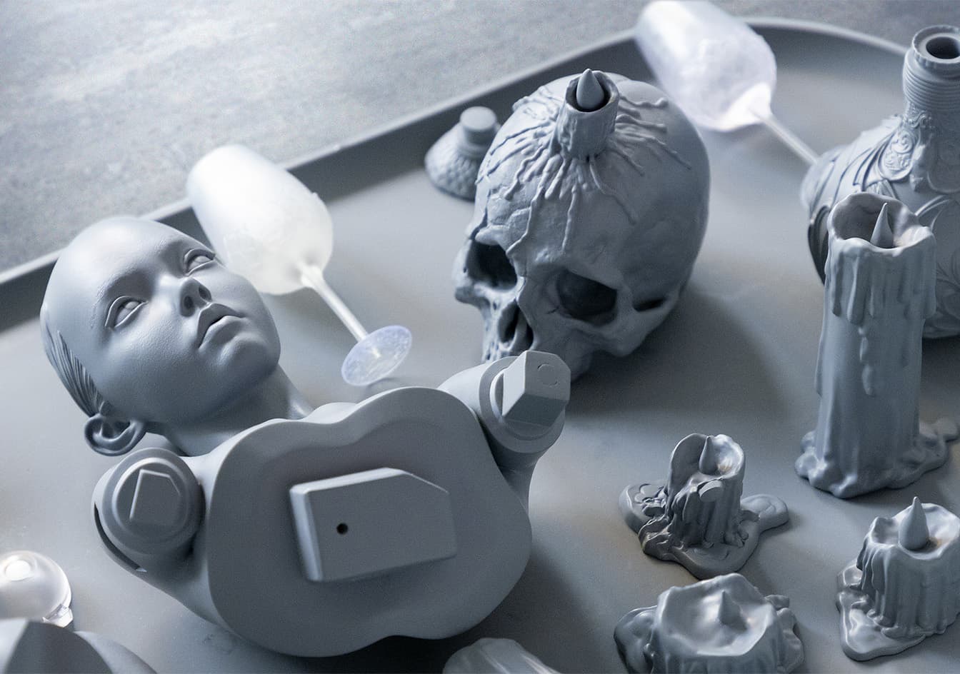 A grey, unpainted prototype of the Morrigan statue, highlighting the raw sculptural details before painting.