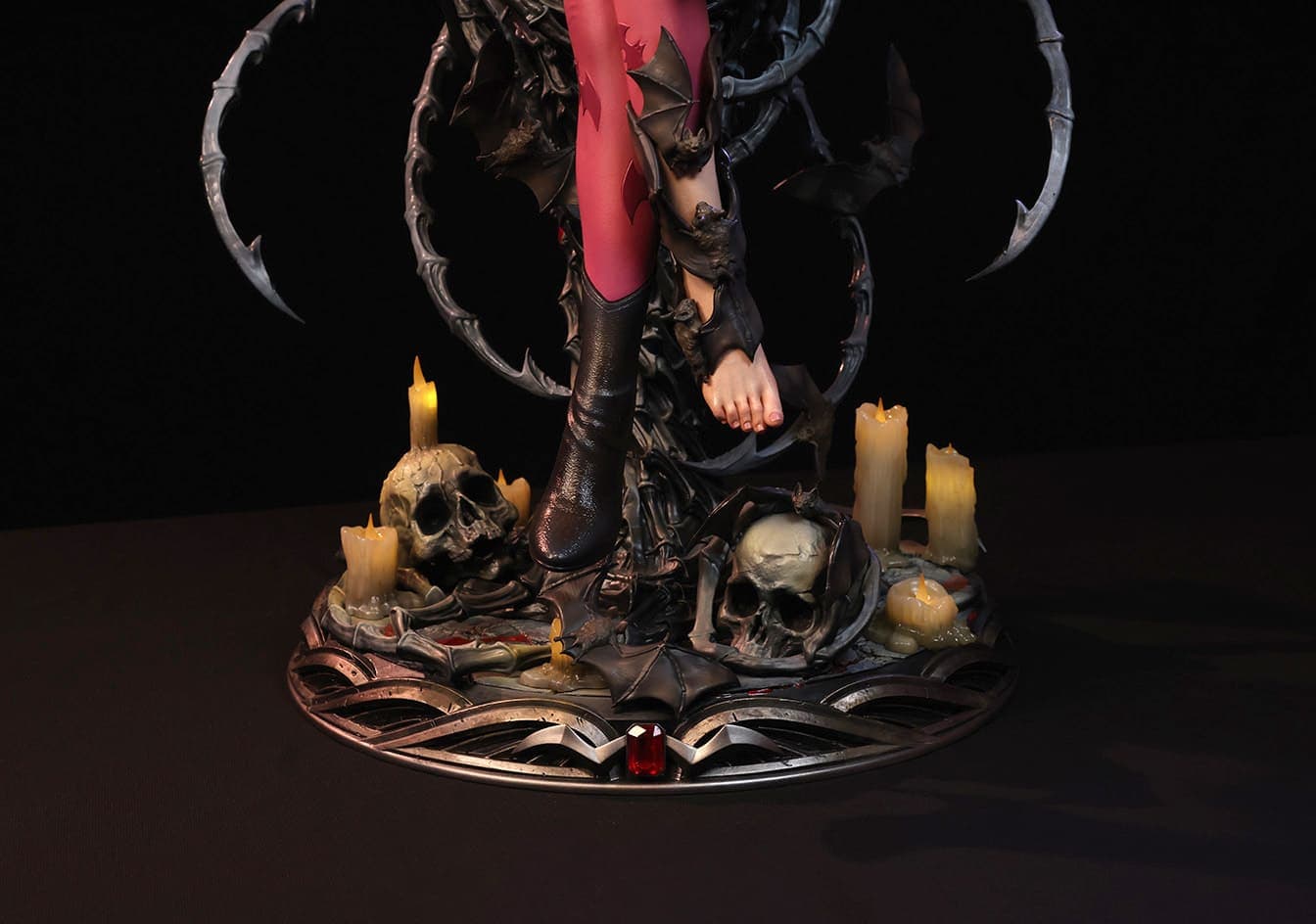 The Morrigan Temptress of Desire statue from a low angle, emphasizing her commanding presence on the throne.